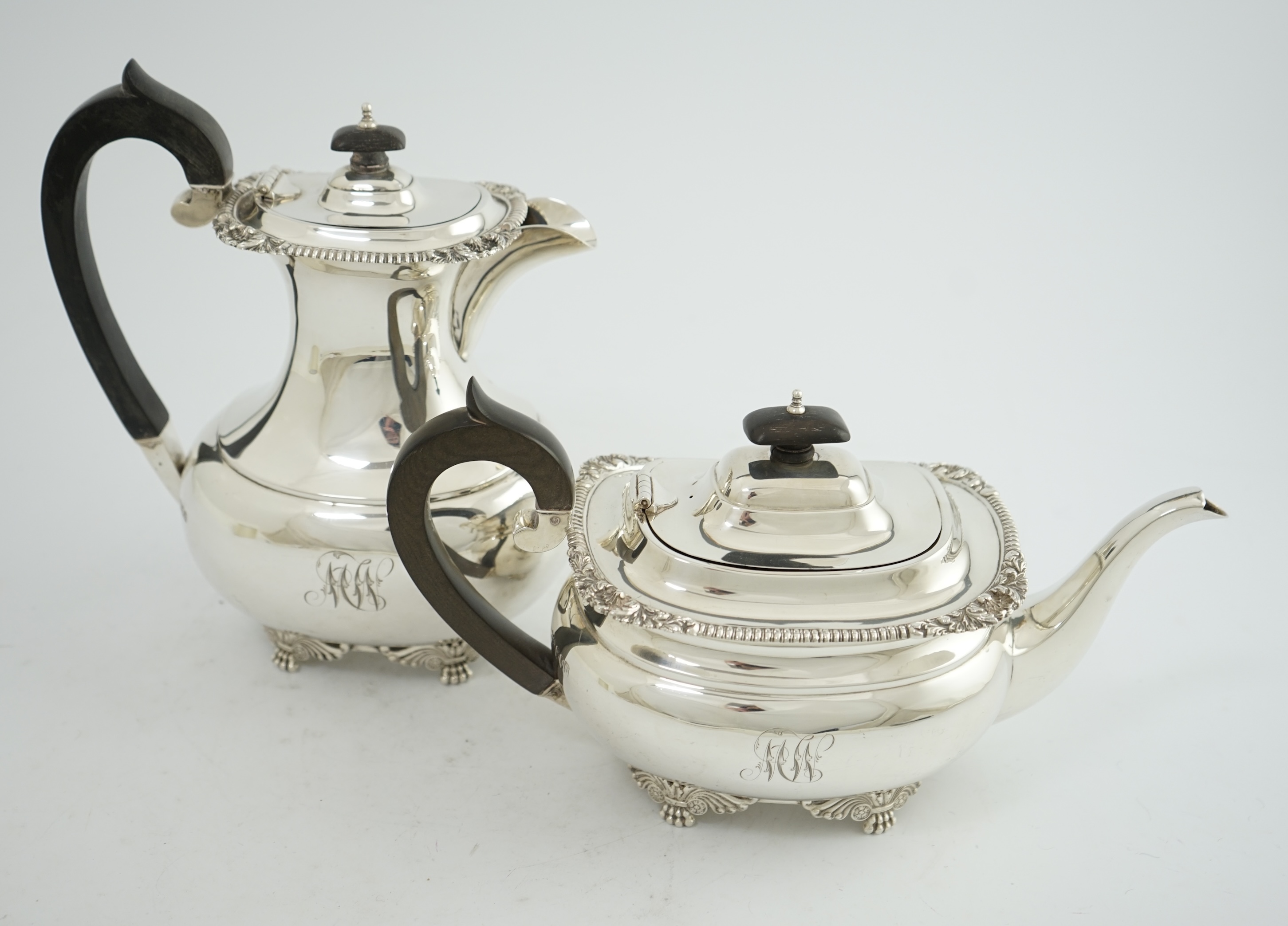 A George V silver hot water pot and matching teapot, by Reid & Sons